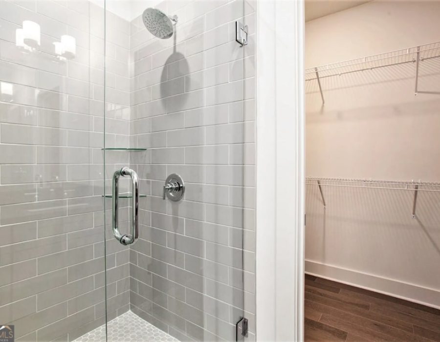 019_unit 1 bathroom to closet-min